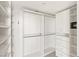 Bright walk-in closet with ample storage space, shelving and drawers at 2777 Paradise Rd # 1208, Las Vegas, NV 89109