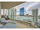 Relaxing balcony with comfortable lounge chairs and views of the city skyline in a high-rise at 2857 Paradise Rd # 2704, Las Vegas, NV 89109