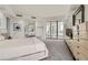 Spacious bedroom with plush carpeting, balcony access, and elegant decor at 2857 Paradise Rd # 2704, Las Vegas, NV 89109
