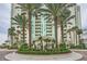 Luxurious building exterior with lush landscaping and palm trees creating a resort-style ambiance at 2857 Paradise Rd # 2704, Las Vegas, NV 89109