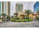 Stunning building exterior featuring a grand entrance with palm trees and manicured landscaping at 2857 Paradise Rd # 2704, Las Vegas, NV 89109