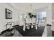 Bright dining area with modern chandelier, glossy black floors, and city views at 2857 Paradise Rd # 2704, Las Vegas, NV 89109
