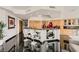 Modern kitchen featuring a spacious island, stainless steel appliances, and sleek black floors at 2857 Paradise Rd # 2704, Las Vegas, NV 89109