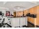 Modern kitchen featuring sleek cabinetry, breakfast bar, and glossy black floors at 2857 Paradise Rd # 2704, Las Vegas, NV 89109