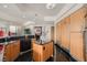 Contemporary kitchen featuring wood cabinetry, a kitchen island, and expansive counter space at 2857 Paradise Rd # 2704, Las Vegas, NV 89109