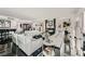 Expansive living room featuring white leather sofas, a fireplace, and piano at 2857 Paradise Rd # 2704, Las Vegas, NV 89109