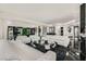 Bright, modern living room with white couches, glossy floors, and sophisticated decor at 2857 Paradise Rd # 2704, Las Vegas, NV 89109