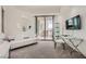 Stylish living room boasts a walkout balcony, neutral carpeting and comfortable furniture at 2857 Paradise Rd # 2704, Las Vegas, NV 89109