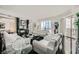 Elegant living room with modern white sofas, a fireplace, and city views at 2857 Paradise Rd # 2704, Las Vegas, NV 89109