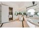 Bright main bathroom features a separate glass enclosed shower and soaking tub at 2857 Paradise Rd # 2704, Las Vegas, NV 89109