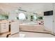 Bright bathroom featuring a soaking tub with lots of mirrors and natural light at 2857 Paradise Rd # 2704, Las Vegas, NV 89109