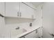 The utility sink includes bright cabinetry and countertop space at 2857 Paradise Rd # 2704, Las Vegas, NV 89109