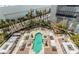 An aerial view of a tranquil outdoor pool area surrounded by cabanas and lush landscaping at 2877 Paradise Rd # 104, Las Vegas, NV 89109