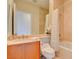 Bathroom features a vanity with a sink, mirror, toilet, and tub/shower combo at 2877 Paradise Rd # 104, Las Vegas, NV 89109