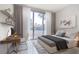 Stylishly designed bedroom with modern decor and a desk facing a large balcony at 2877 Paradise Rd # 104, Las Vegas, NV 89109
