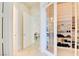 Spacious walk-in closet with glass doors, featuring extensive shelving for organized storage at 2877 Paradise Rd # 104, Las Vegas, NV 89109