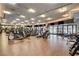 Spacious gym featuring modern exercise equipment, hardwood floors, recessed lighting, and large windows at 2877 Paradise Rd # 104, Las Vegas, NV 89109