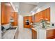 Stylish kitchen featuring granite counters, gas range, and stainless steel appliances with sleek tile flooring at 2877 Paradise Rd # 104, Las Vegas, NV 89109