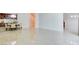 Bright open-plan room with high-gloss tile flooring that flows throughout the living space at 2877 Paradise Rd # 104, Las Vegas, NV 89109