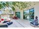 Expansive patio with stylish seating, lush greenery, and sleek marble flooring at 2877 Paradise Rd # 104, Las Vegas, NV 89109