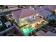 Aerial view showcasing a private backyard oasis with pool, covered patio, balcony, and lush landscaping at 296 Brushy Creek Ave, Las Vegas, NV 89148