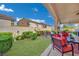 Relaxing backyard patio with outdoor seating and green grass at 296 Brushy Creek Ave, Las Vegas, NV 89148