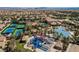 Aerial view of the community pool area with water slides, playground, and other recreational facilities at 296 Brushy Creek Ave, Las Vegas, NV 89148