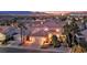 Stunning exterior with desert landscaping, palm trees, and breathtaking sunset views at 296 Brushy Creek Ave, Las Vegas, NV 89148