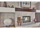 Elegant stone fireplace featuring a decorative mantle and adjacent shelving niches at 296 Brushy Creek Ave, Las Vegas, NV 89148