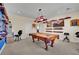 Spacious game room showcasing a classic pool table and custom decorative shelving at 296 Brushy Creek Ave, Las Vegas, NV 89148