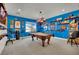Bright game room featuring a pool table, sports memorabilia, and a cozy atmosphere at 296 Brushy Creek Ave, Las Vegas, NV 89148