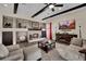 Comfortable living room with stone fireplace and dark wood beam ceiling at 296 Brushy Creek Ave, Las Vegas, NV 89148