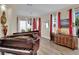 Elegant living room featuring a grand piano, hardwood floors, bright windows, and stylish decor at 296 Brushy Creek Ave, Las Vegas, NV 89148