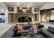 Beautifully decorated resident lounge with stone fireplace, sofas, and elegant accents at 296 Brushy Creek Ave, Las Vegas, NV 89148