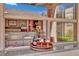Outdoor bar with sink, granite counters, and wine storage at 296 Brushy Creek Ave, Las Vegas, NV 89148