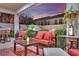 Relaxing outdoor patio with comfortable seating, a dining area, and lush greenery, creating a tranquil retreat at 296 Brushy Creek Ave, Las Vegas, NV 89148