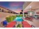 Inviting backyard featuring a pool, patio furniture, and barbecue area, perfect for relaxation and entertaining guests at 296 Brushy Creek Ave, Las Vegas, NV 89148