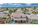 Back of house with a balcony, patio, pool, and outdoor seating area at 296 Brushy Creek Ave, Las Vegas, NV 89148
