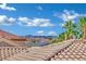 High angle roof shot showcasing palm trees, neighboring homes, and mountain views at 296 Brushy Creek Ave, Las Vegas, NV 89148