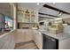 Wet bar area featuring granite countertops, custom cabinets, and a built-in mini-refrigerator at 296 Brushy Creek Ave, Las Vegas, NV 89148