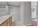 Bathroom with granite counters and glass enclosed shower stall at 3097 Quail Crest Ave, Henderson, NV 89052