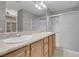 Bright bathroom featuring a double sink vanity and a glass-enclosed shower at 3097 Quail Crest Ave, Henderson, NV 89052