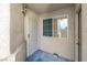Covered front porch entryway with security door and tan paint at 3097 Quail Crest Ave, Henderson, NV 89052