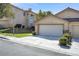 Charming single-story home with a three car garage, tile roof and well-maintained landscaping at 3097 Quail Crest Ave, Henderson, NV 89052