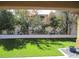 An outdoor shot of a well manicured backyard that features desert landscaping and artificial turf at 32 Feather Sound Dr, Henderson, NV 89052