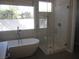 Modern bathroom featuring a soaking tub and walk-in shower at 32 Feather Sound Dr, Henderson, NV 89052