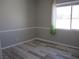 Bright bedroom with light wood floors and a large window at 32 Feather Sound Dr, Henderson, NV 89052