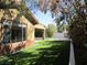 Home exterior shows a lawn and desert landscaping around the side of the house at 32 Feather Sound Dr, Henderson, NV 89052