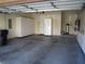 Spacious garage with ample storage cabinets and a water filtration system at 32 Feather Sound Dr, Henderson, NV 89052