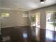 Spacious living room featuring hardwood floors, recessed lighting, and sliding glass doors to the backyard at 32 Feather Sound Dr, Henderson, NV 89052